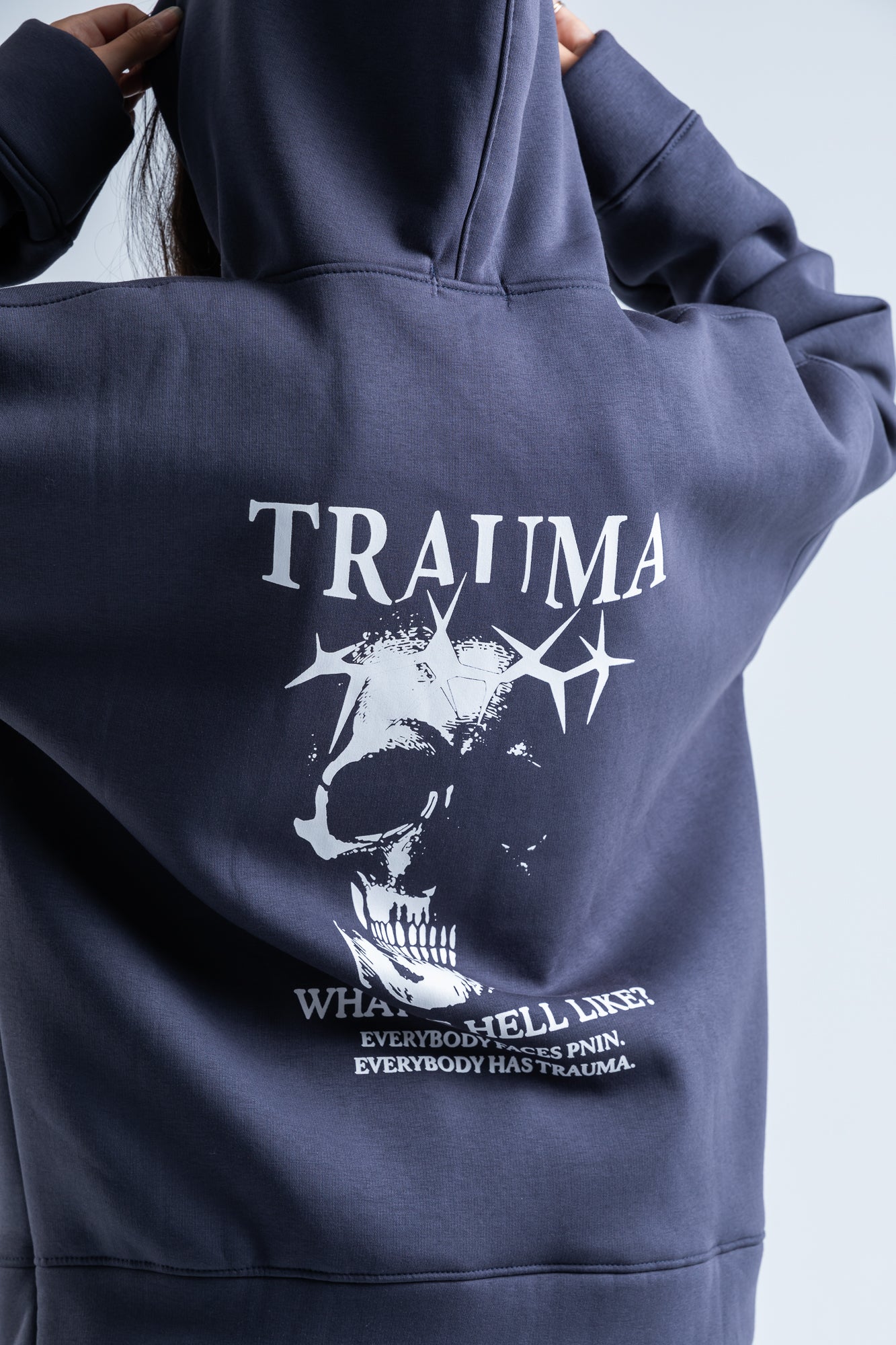 Close-up of Trauma hoodie showing detailed graphic design and soft fabric for a stylish and comfortable look.